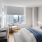 bedroom with a large window and modern decor