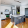 kitchen with an island, modern appliances and spacious counter-space