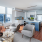 living area that includes kitchen and bright lighting