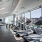Fitness center with elliptical looking out into a city view
