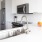 Kitchen with white quartz countertops and stainless steel appliances